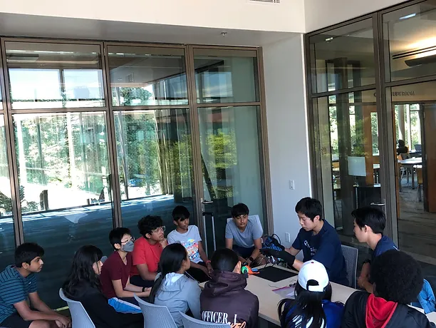 MissionRC mentors helping students during a workshop